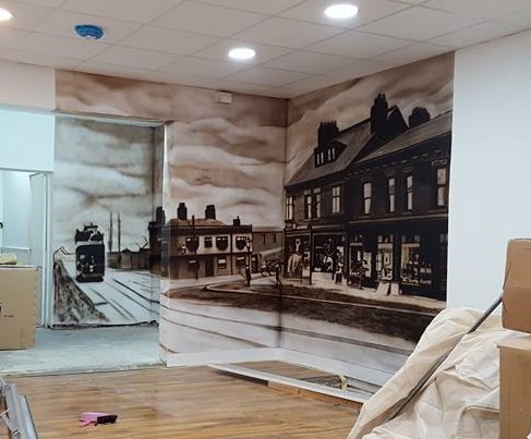 Airbrushed Painting of a Mural in Hair Salon with historic image of shop